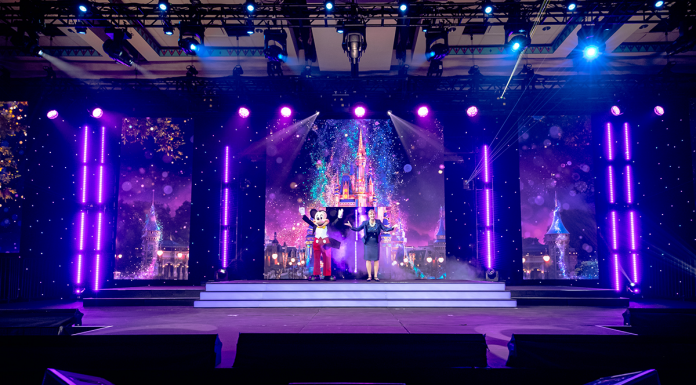 Reduce Event Production Costs With Disney Meetings & Events Mickey on stage with CEO - Disney Meetings & Events